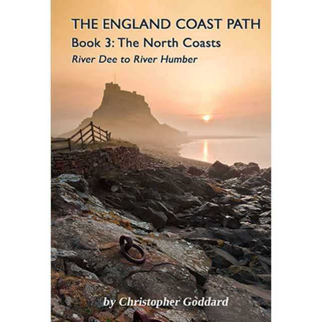 Book cover for 'The England Coast Path: Book 3: The North Coasts - River Dee to River Humber' by Christopher Göddard, featuring a coastal landscape with a rocky shore, a stone wall, and a castle under a warm sunset sky.