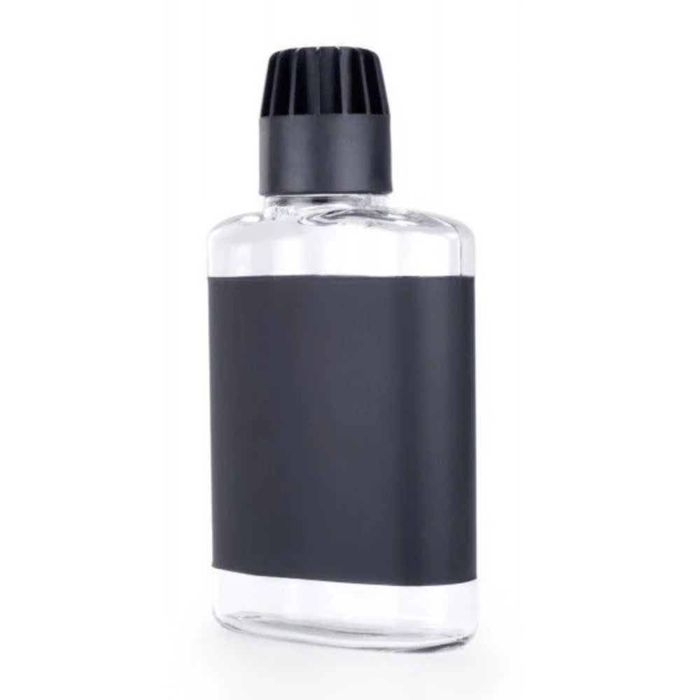 Clear hip flask with black cap on a white background