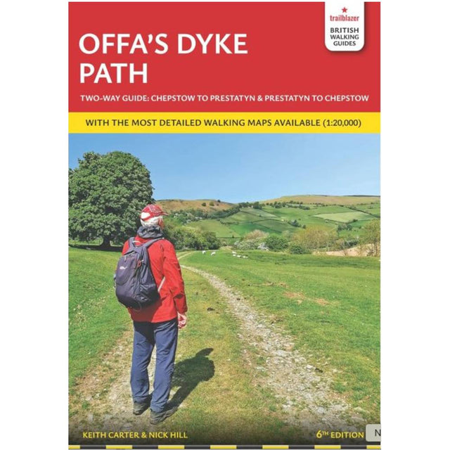 Book cover of Offa's Dyke Path guidebook with a person walking on a path and green fields.