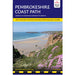 Cover of Pembrokeshire Coast Path guidebook with a scenic view of a beach and cliffs.