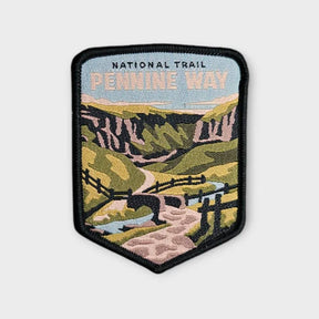 Embroidered patch of the Pennine Way National Trail with a scenic design on a white background.