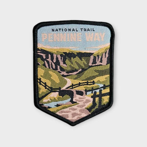 Embroidered patch of the Pennine Way National Trail with a scenic design on a white background.