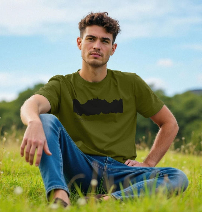 Man sitting down wearing printed t-shirt