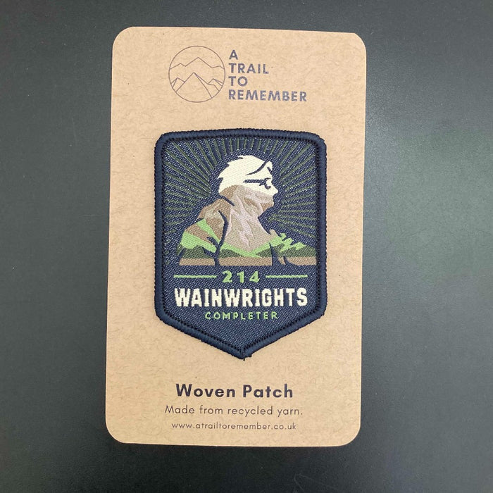 Woven Wainwrights Completer patch on a cardboard card with 'A Trail to Remember' branding