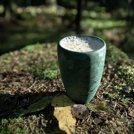 Kupilka green coffee-go cup with frothy coffee